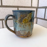 Relief Carved Bear & Sun Mug