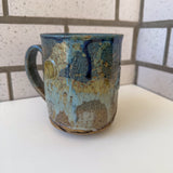 Relief Carved Bear & Sun Mug