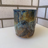 Relief Carved Bear & Sun Mug