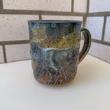 Relief Carved Bear & Sun Mug