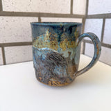 Relief Carved Bear & Sun Mug