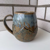 Relief Carved Mountain Mug
